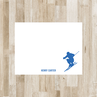 Personalized skier flat notecard with blue skier and blue name