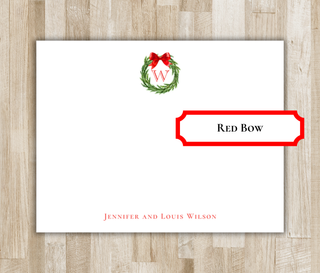 Personalized monogram wreath flat notecard with red bow, red monogram and red name