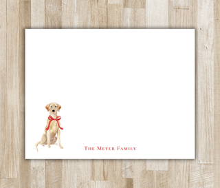 Personalized flat notecard with watercolor yellow lab wearing a red bow and red family name
